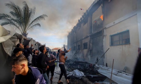 An Israeli attack on an UNRWA building housing displaced Palestinians in Khan Younis set a building on fire and killed at least nine people.