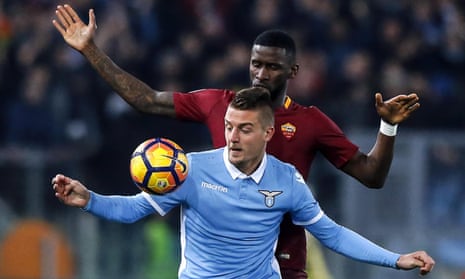 Lazio’s Sergej Milinkovic-Savic, who scored their first goal, holds off Roma’s Antonio Rüdiger, who was subject to concerted racist chanting by Lazio fans