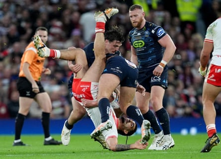 Tyrone May is tackled by Brad O’Neill and Liam Byrne during the 2025 Super League Grand Final