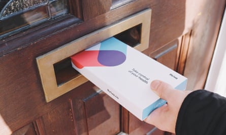 A hand putting a Thriva health test through a letterbox