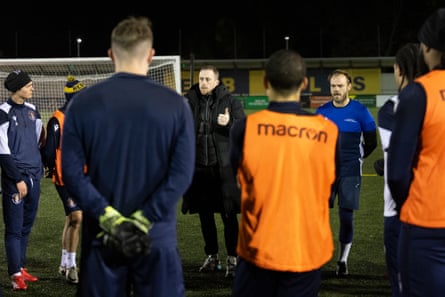 Scott Davies, player-manager of Slough Town, talks to his players during a training session.