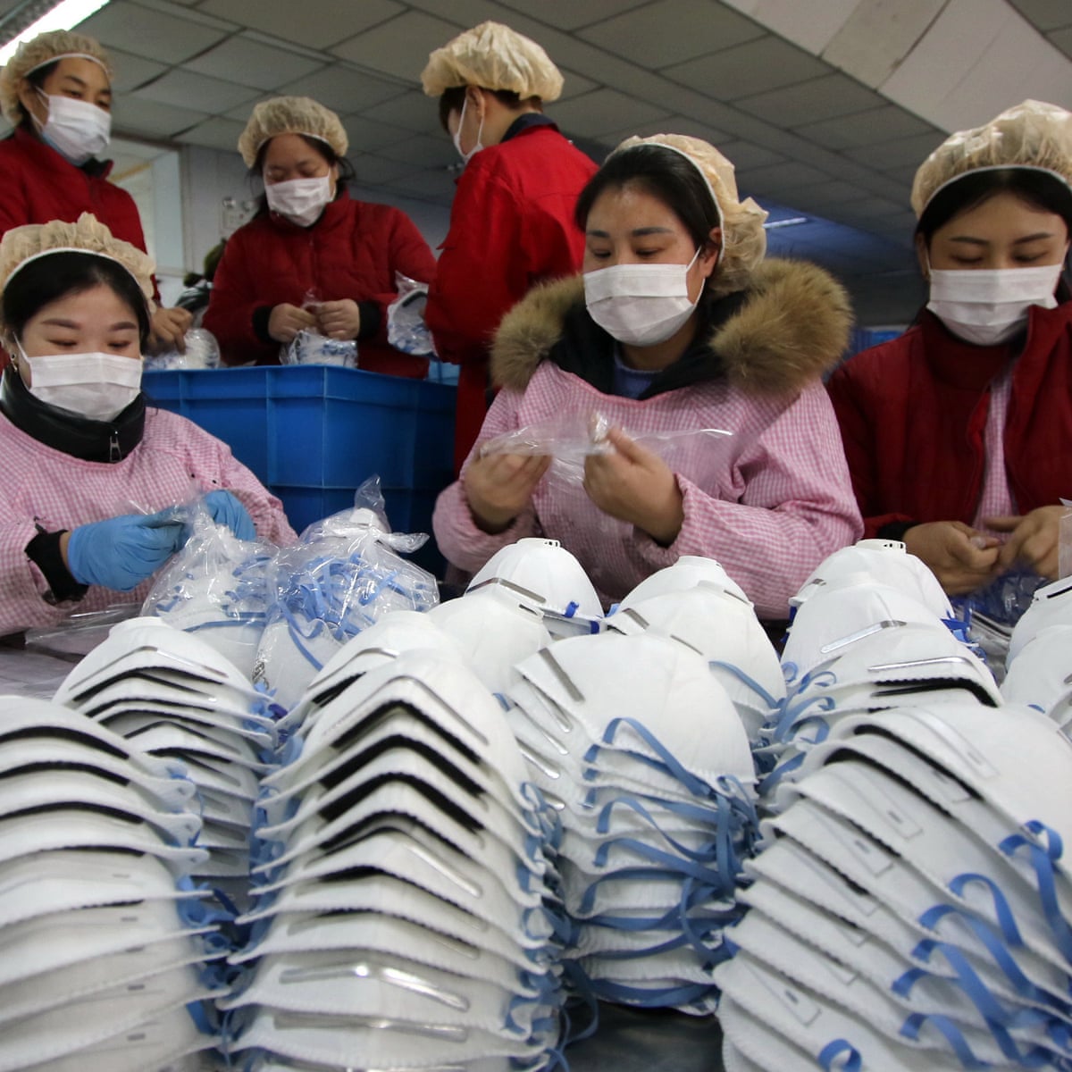 Coronavirus: China mask producers work overtime to meet demand | China | The Guardian