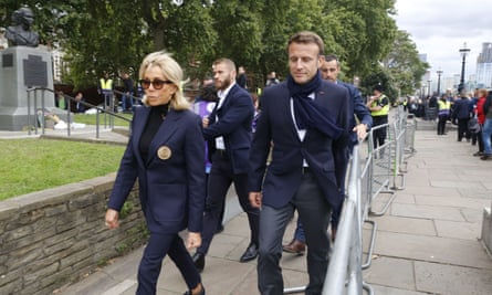 Emmanuel Macron with his wife Brigitte visiting Queen Elizabeth II lying in state in London.