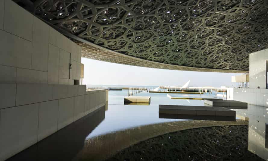 Boats anchored                      outside the Louvre Abu Dhabi.