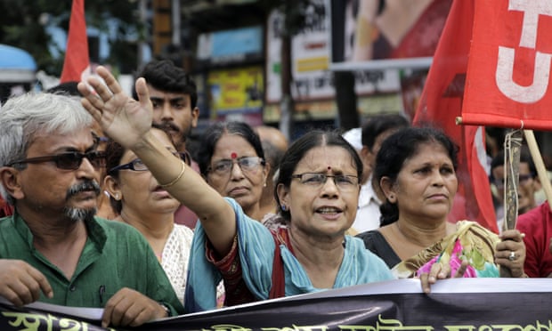 Activists of Communist party of India (Marxist) shout slogans during a nationwide strike in Kolkata, India
