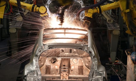 Robotic arms assemble a car at Nissan's Sunderland plant