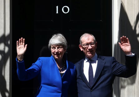 Theresa and Philip May wave outside Downing Street
