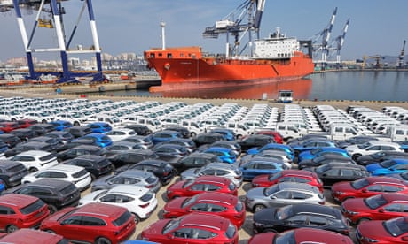 Cars for export at a port in Yantai, in eastern China's Shandong province