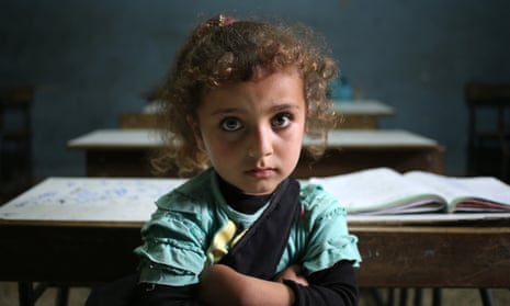 Syrian refugee girl sits in a classroom at a Lebanese public school.