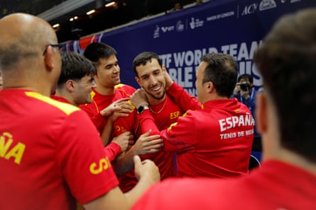 Álvaro Robles of Spain (ranked 67) is mobbed by teammates after clinching a shock victory, on his fourth match point, over the world No 14 Darko Jorgic of Slovenia