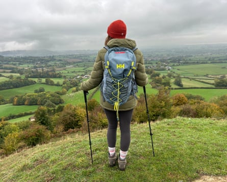 The writer on a hilltop testing walking poles