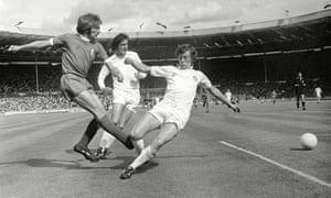 Trevor Cherry (right) tries to stop a cross from Liverpool’s Steve Heighway as his Leeds teammate Norman Hunter closes in during the 1974 Charity Shield.