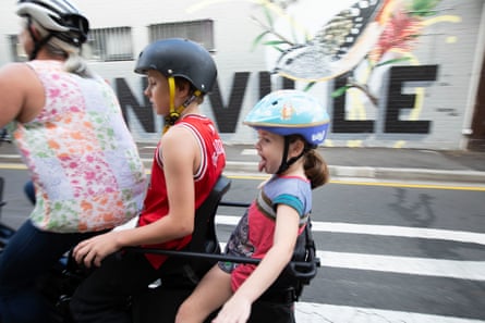 Peperkamp rides her bike through Erskineville in Sydney’s inner west with her children.