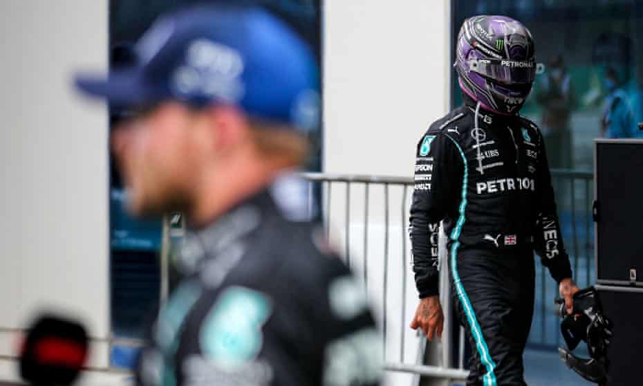 Lewis Hamilton (right) walks past the race winner and teammate Valtteri Bottas after the race.