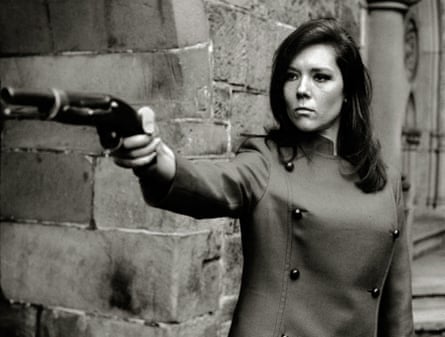 Rigg in The Avengers circa 1965. She is pointing a gun