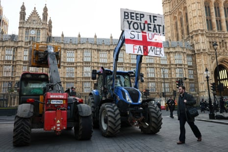 A tractor with a protest sign outside the Houses of Parliament this morning.