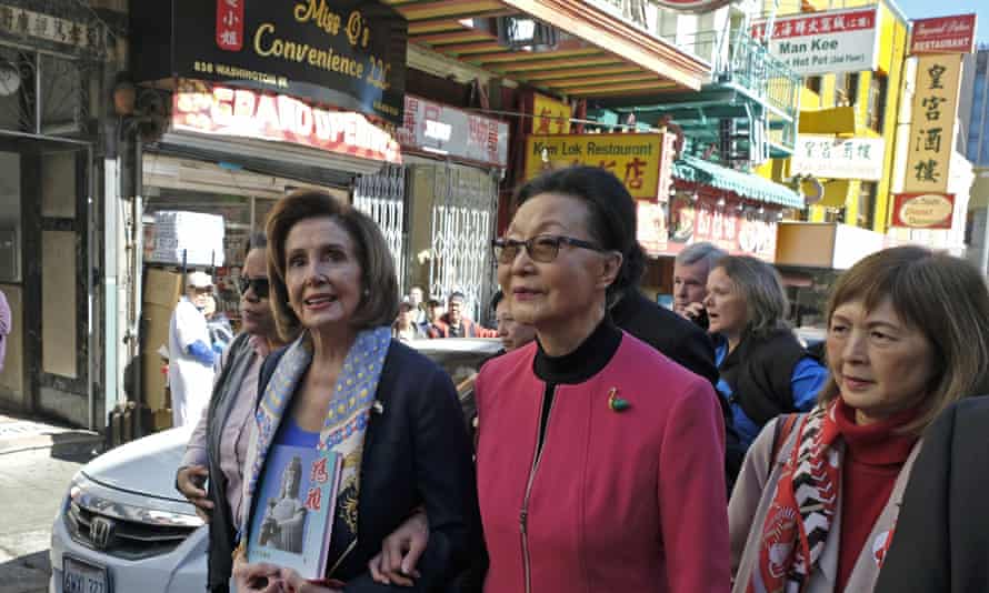 Nancy Pelosi walks with Florence Fang and Claudine Cheng, right, during a tour of Chinatown, 24 February 2020.