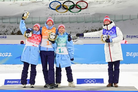 Norway’s team (L-R) Marte Olsbu Roeiseland, Johannes Thingnes Boe, Tiril Eckhoff and Tarjei Boe celebrate their first place on the podium.