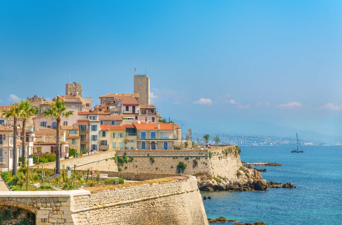 Mediterranean town by the sea with sea walls.