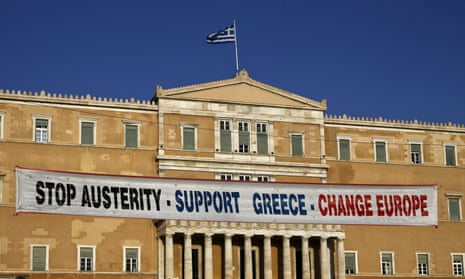 A banner on the parliament building during a pro-government rally calling on Greece’s European and IMF creditors to soften their stance in the cash-for-reforms talks in Athens.