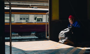 Woman cleaning the inside of a goods wagon at Bangkok’s Hualamphong railway station. 6 May 2023