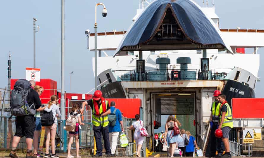Passengers bound for Arran board the ferry