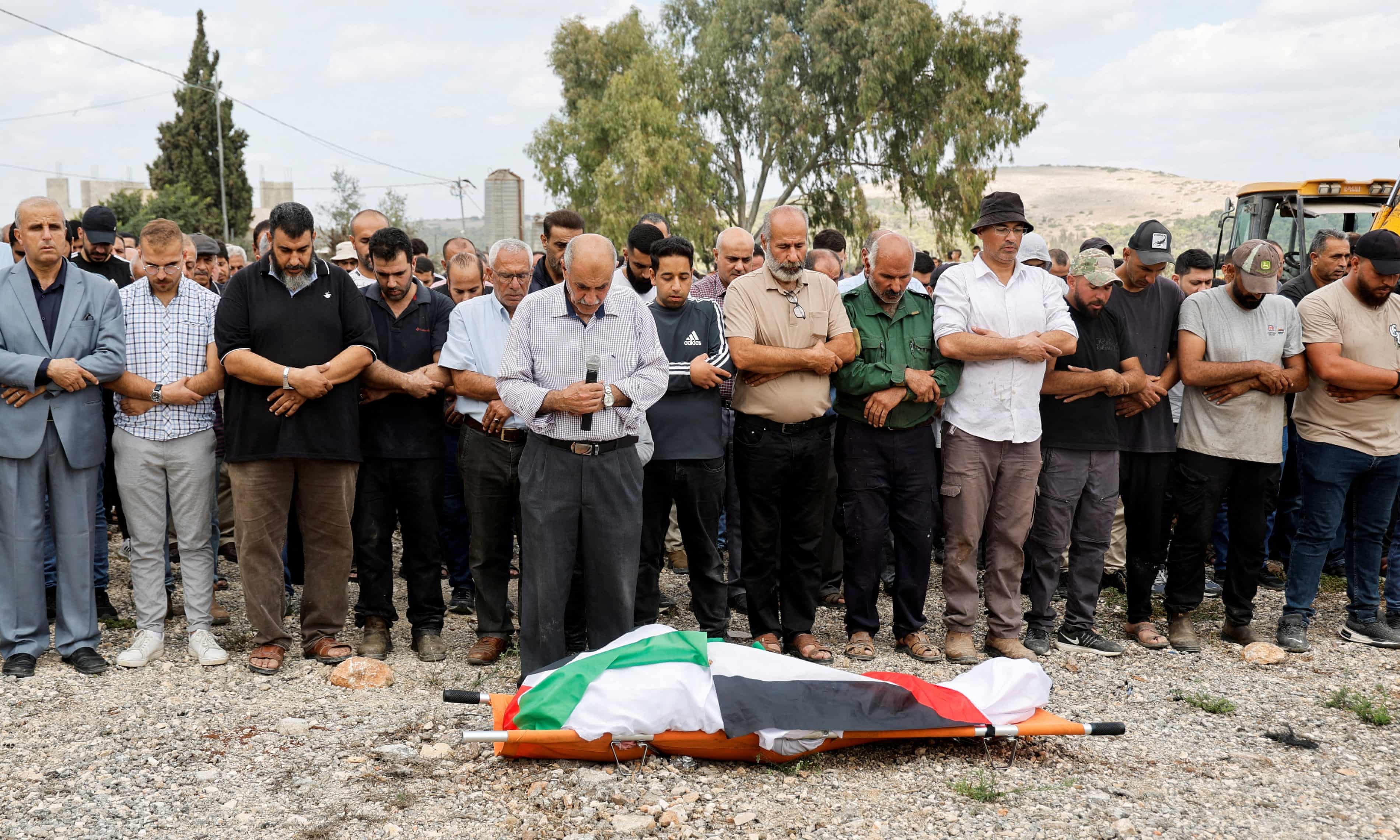 Mourners at the funeral of Hanan Abd Rahman Abu Salameh, who was shot by an Israeli soldier while she harvested olives in Faqqua near Jenin. Photograph: Raneen Sawafta/Reuters