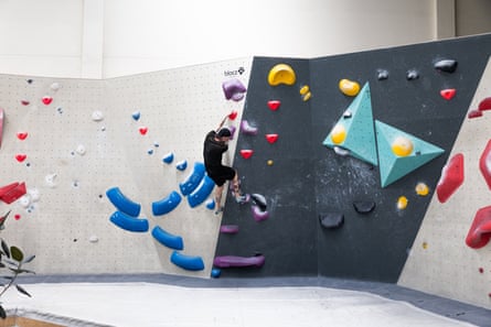 Person on colourful bouldering wall