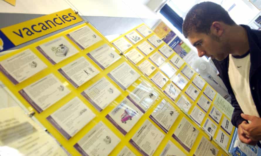 person looking at job posting board