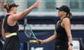 Aryna Sabalenka (right) greets Paula Badosa at the net