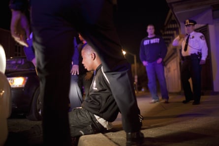 Police officers arrest a suspected drug dealer in Baltimore, Maryland.