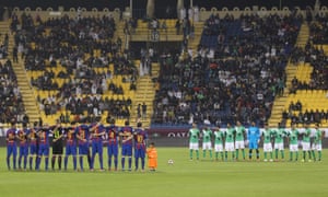 Teams observe one minute of silence during the Qatar Airways Cup match in Doha between Barcelona and Al-Ahli Saudi FC on 13 December 2016