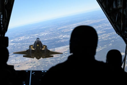 An F-35A Lightning II aircraft flies in formation from the cargo ramp of a C-130J Hercules out of RAAF Base Richmond, Sydney, in August.