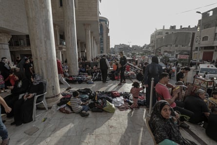 Palestinians take shelter at al-Quds hospital in the Tel al-Hawa neighbourhood of Gaza City.