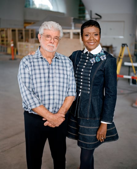 a man and woman smiling for the camera