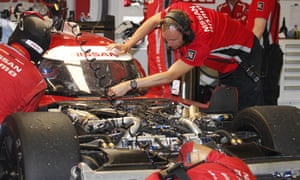 The Nissan crew get to grips with a recalcitrant engine in a bid to make the finish.