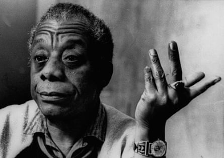 baldwin gestures with one hand