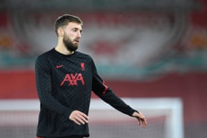 Liverpool’s Nathaniel Phillips warms up at Anfield.