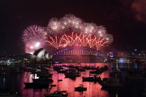 Sydney Opera House and Harbour Bridge turn pink as Australia welcomes in the new year