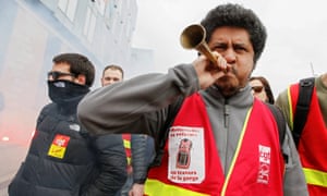 Employees of the French state-owned railway company SNCF attend a demonstration in Lyon as part of a nationwide strike.