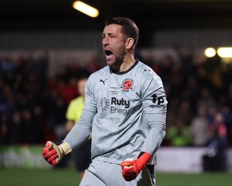 Jay Lynch of Fleetwood Town celebrates saving Arsenal's fourth penalty taken by Bruno Guimaraes.