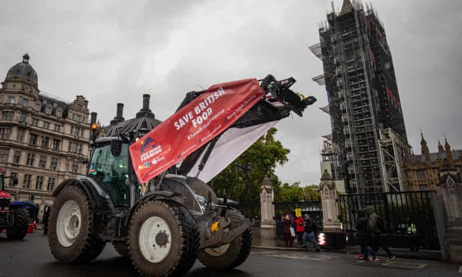 Farmers in tractors take part in a protest over food and farming standards