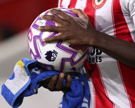 Brentford’s Michael Kayode dries the ball before one of his trademark long throws against Liverpool in October