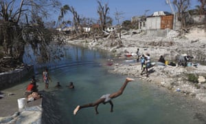 Locals wash clothes in Port Salut south-west of Port-au-Prince on Wednesday.