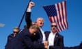 Republican presidential candidate former President Donald Trump is surrounded by US Secret Service agents at a campaign rally in Pennsylvania. 