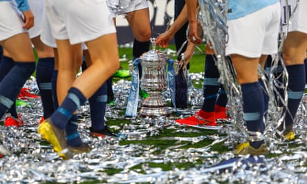 Manchester City players celebrate with the trophy after winning the Women’s FA Cup last year.