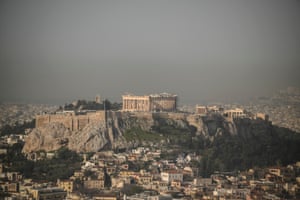 Athens scene with Acropolis under pall of smog