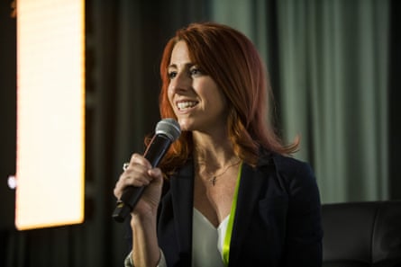 A woman speaks into a microphone