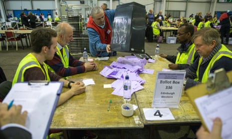 The first of the ballot boxes is tipped out to count in the City of Edinburgh