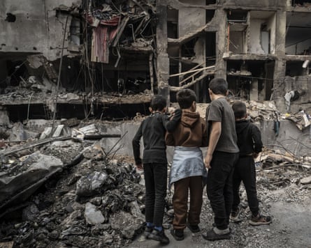 Lebanese children amid the rubble after an Israeli strike on Beirut.